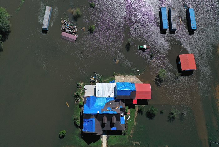 Risk Rating 2.0 affects the average cost of flood insurance for homes like this flooded property in Louisiana.