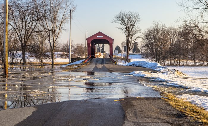 A rural road flooded by the Sandusky River in Upper Sandusky, Ohio.